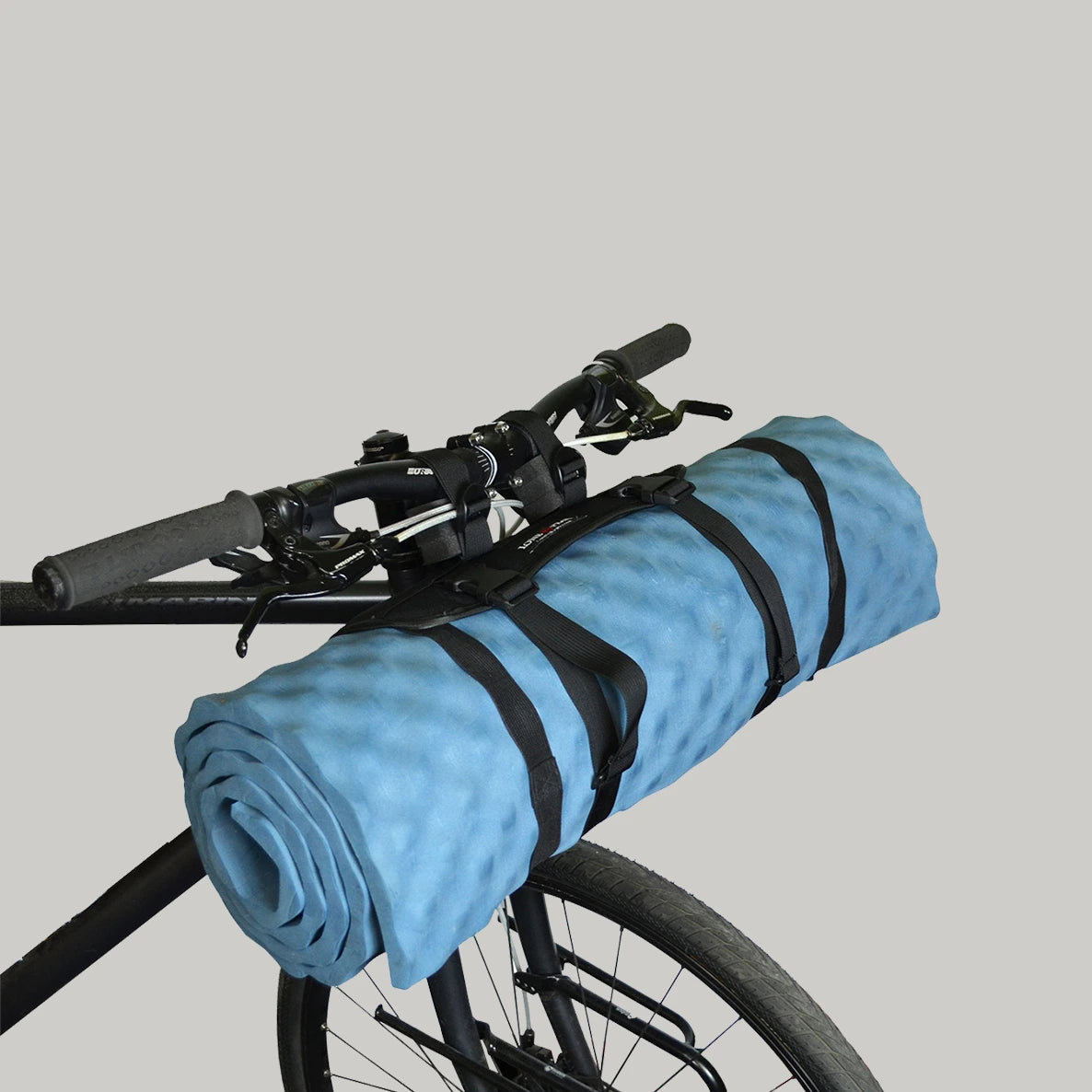 bike packing handlebar hauler with sleeping pad